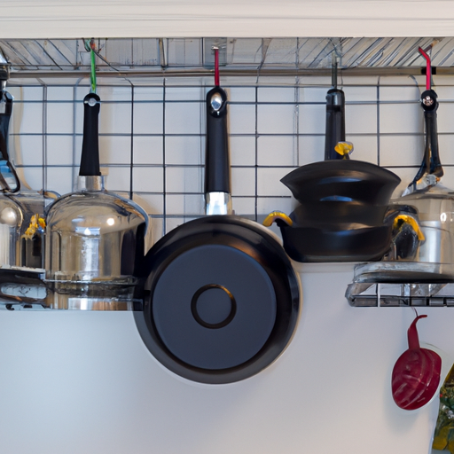 A pot rack hanging above a kitchen island with various pots and pans displayed.